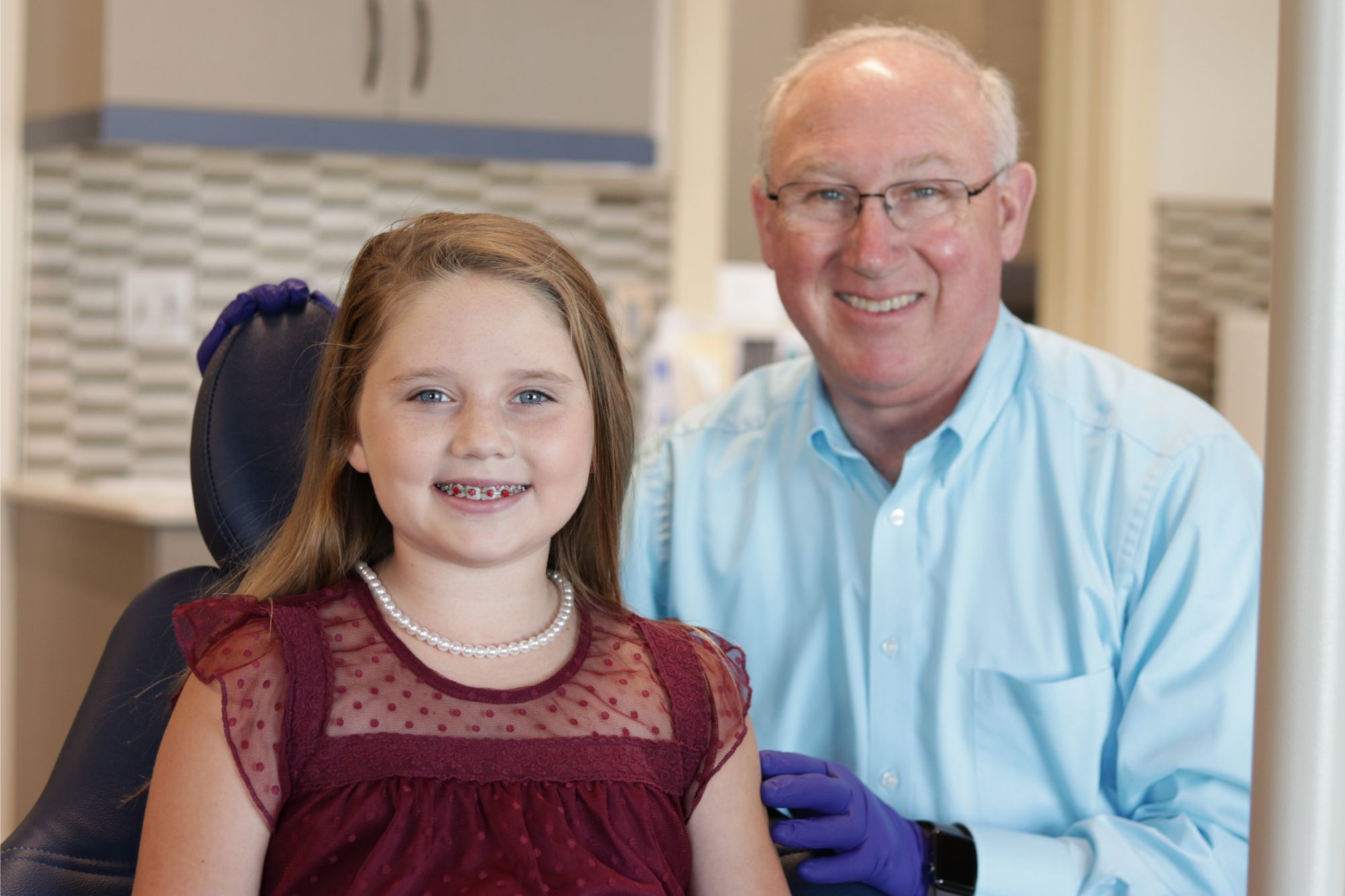 IMG_1875 Dr. John Benton smiling with a young patient