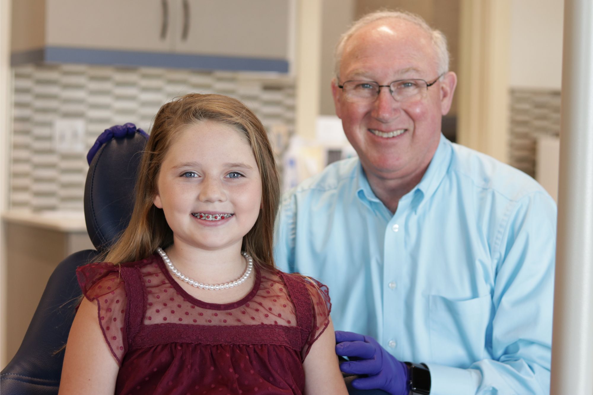 Dr. John Benton smiling with a young patient