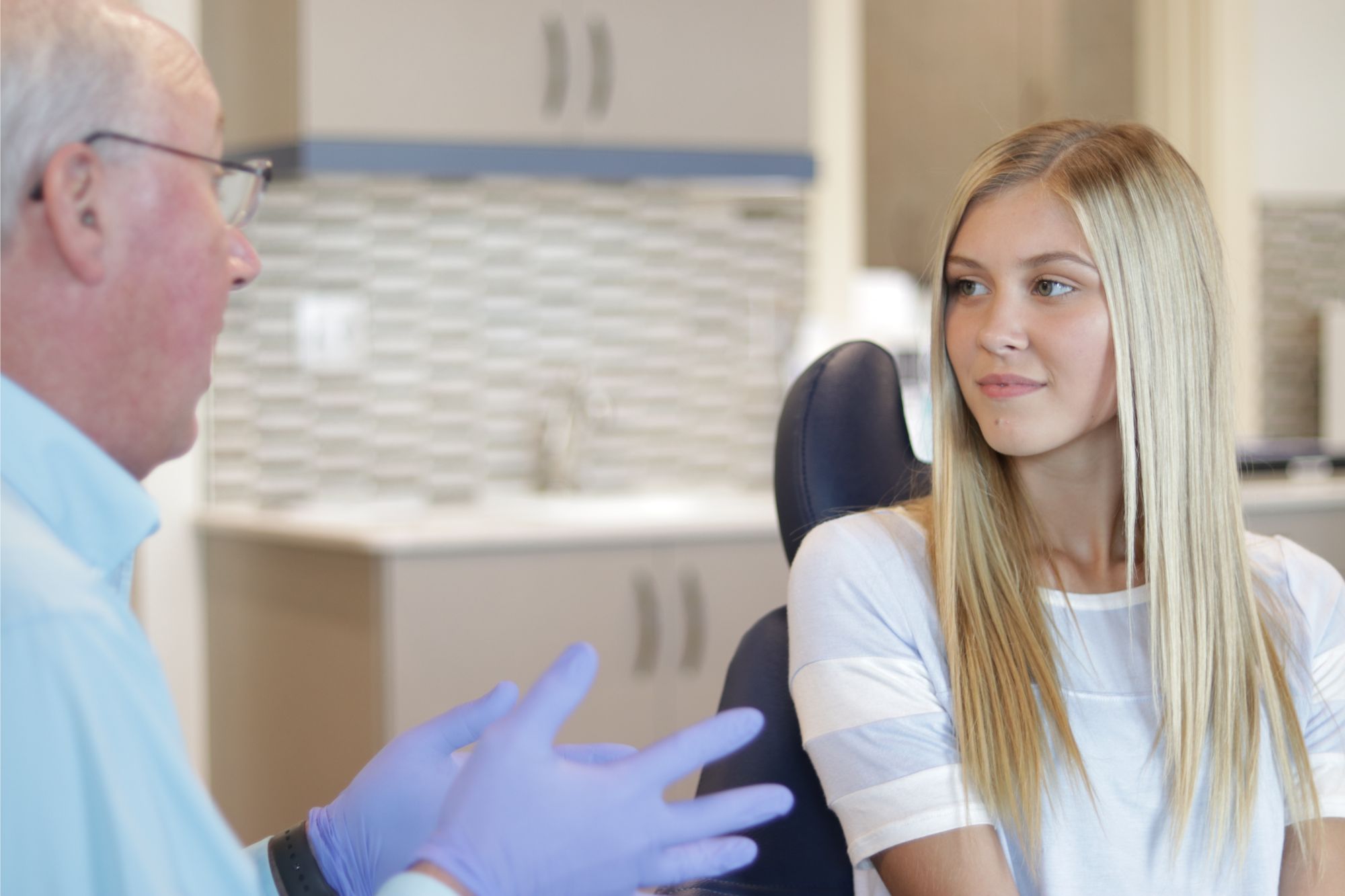 Teen visiting with Dr. Benton