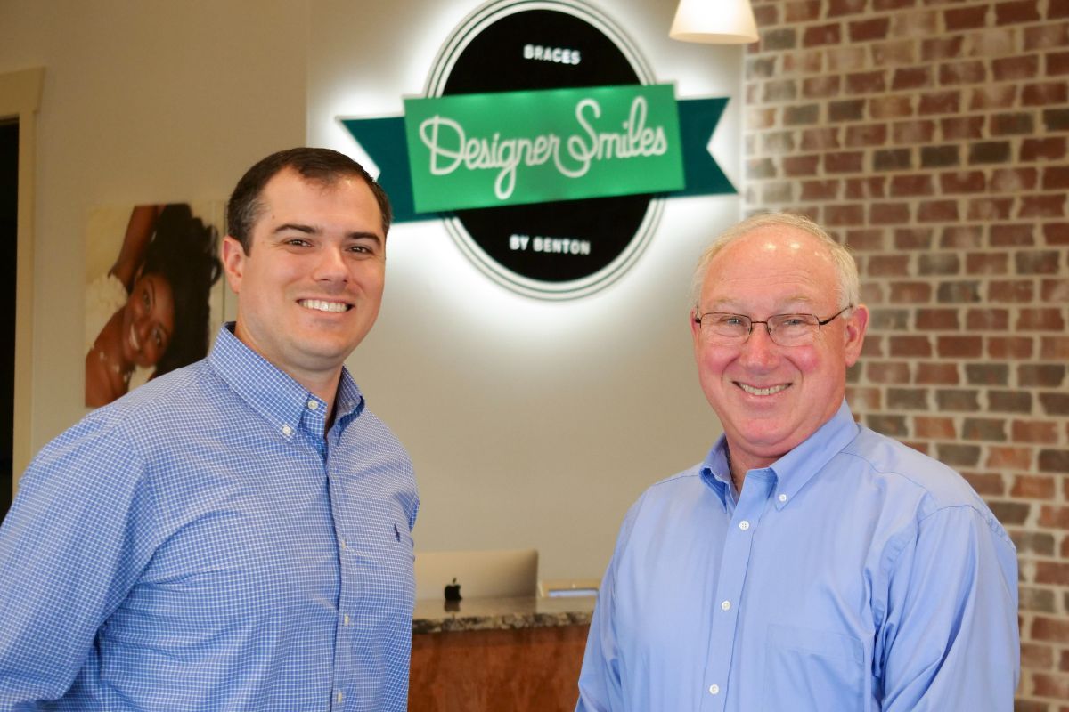 Dr. John Benton and Dr. Barry Benton smiling together in the Designer Smiles by Benton office
