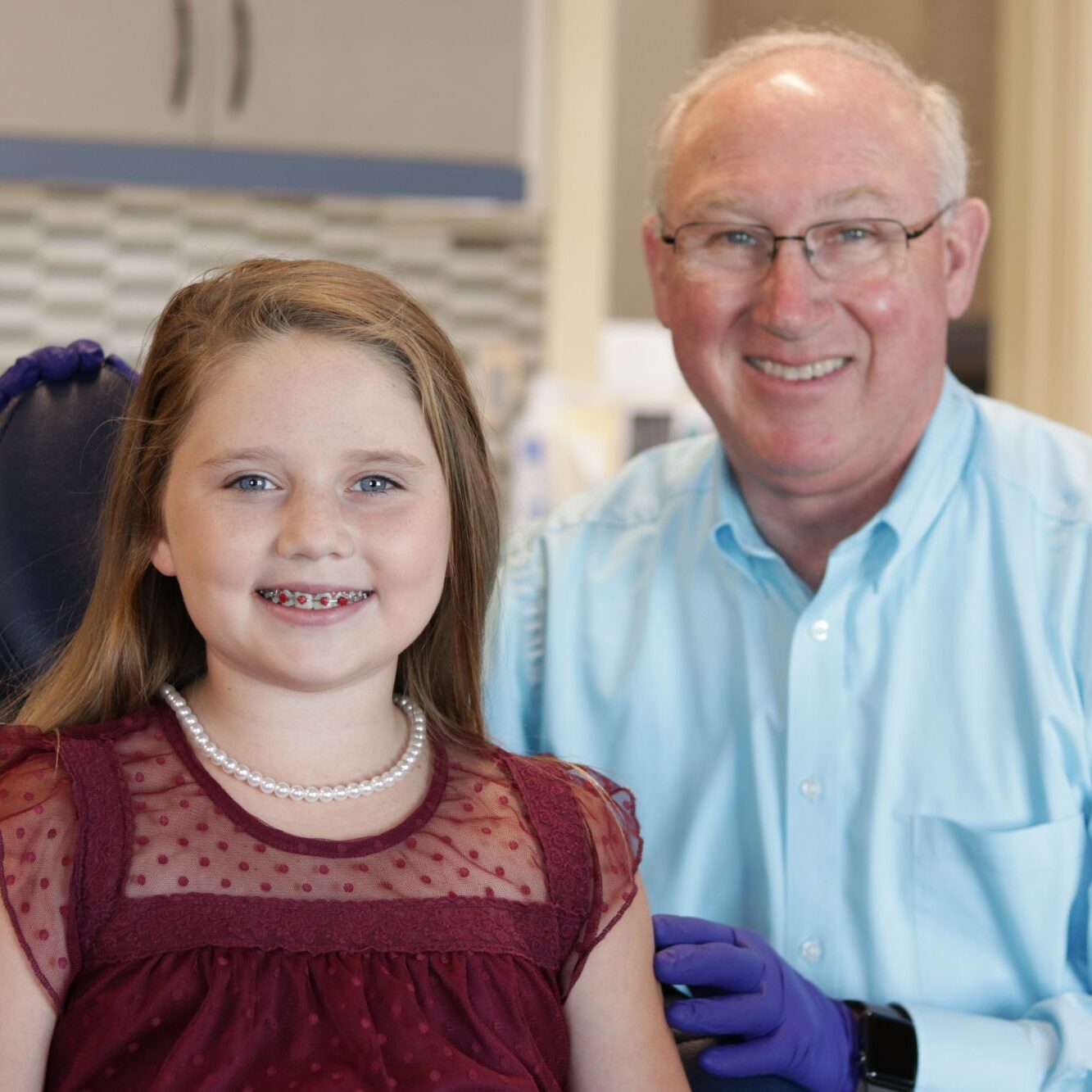 Dr. John Benton smiling with a young patient