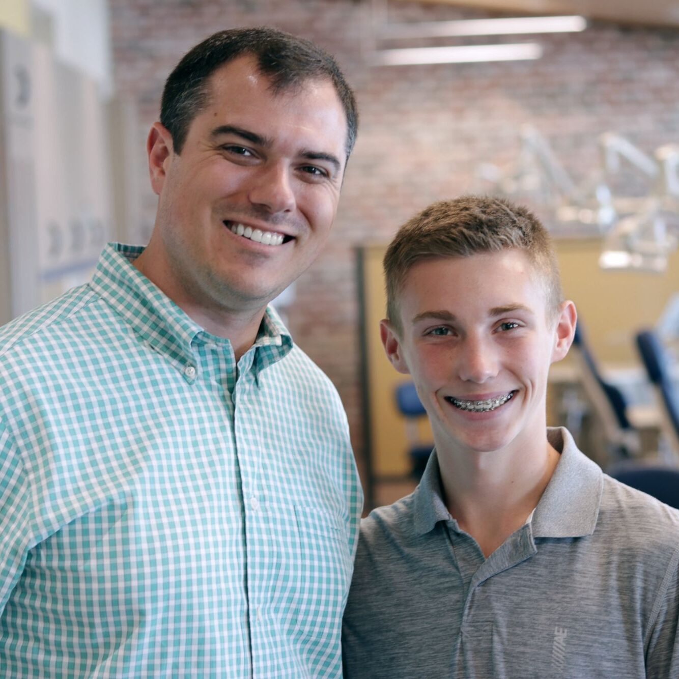 Dr. Barry Benton smiling with a patient